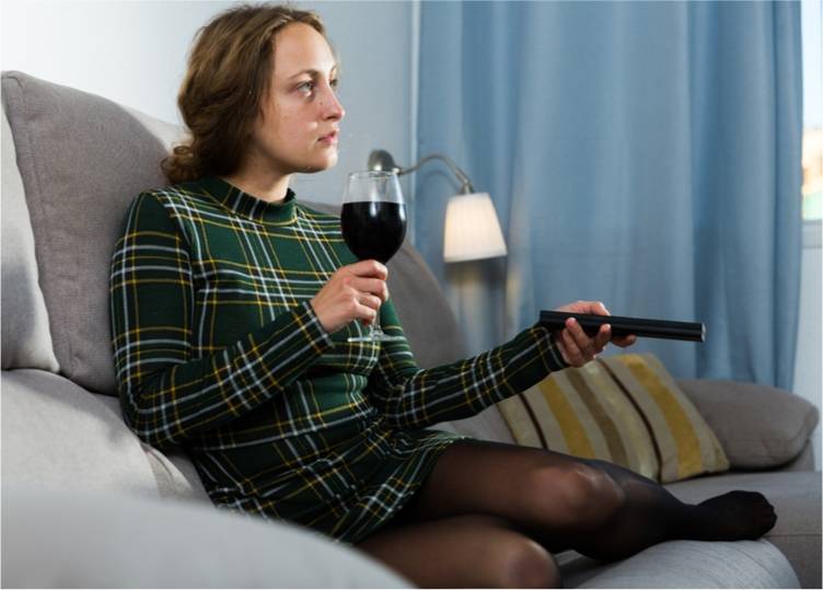 young woman drinking alone alcohol withdrawal blog